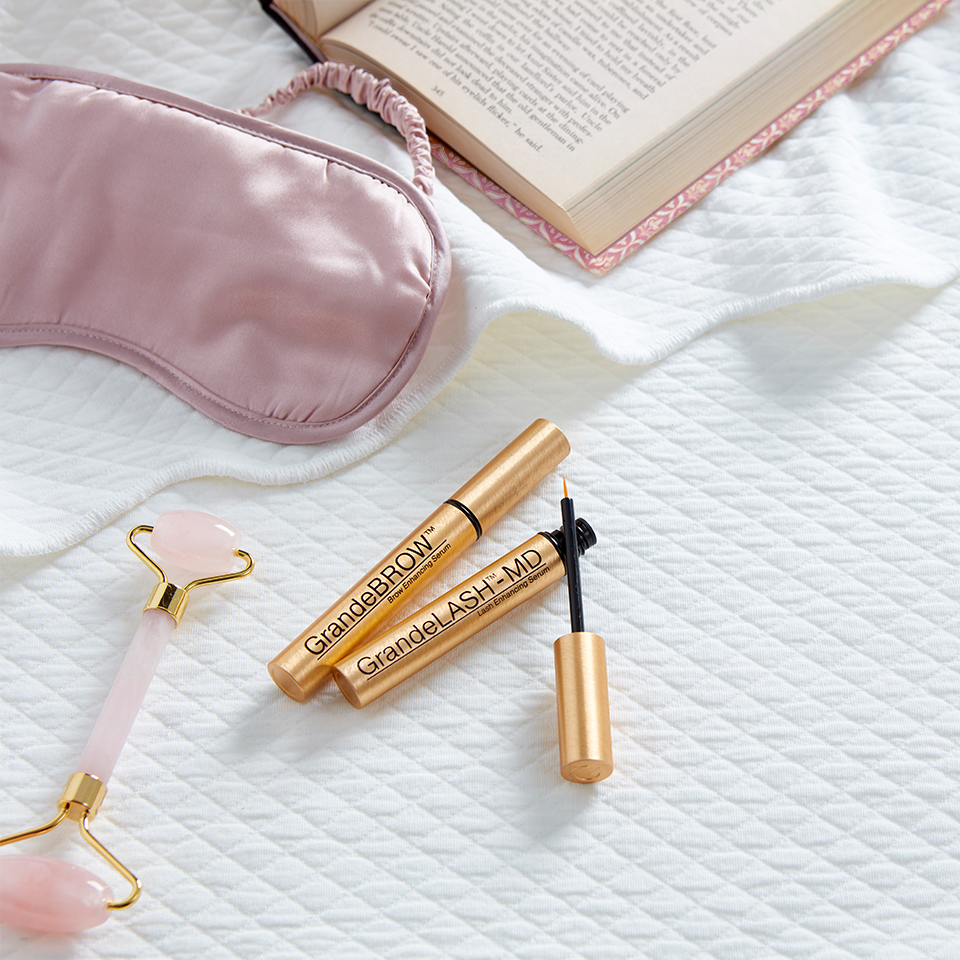 GrandeCosmetics products laying on bed | SalonCentric